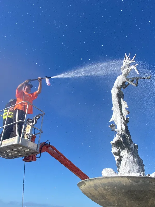person using pressure washing technique Ceramic Coating for RVs & Airstreams