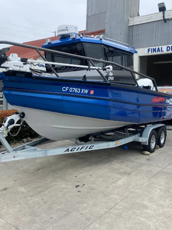 shinny blue and white boat Ceramic Coating for RVs & Airstreams